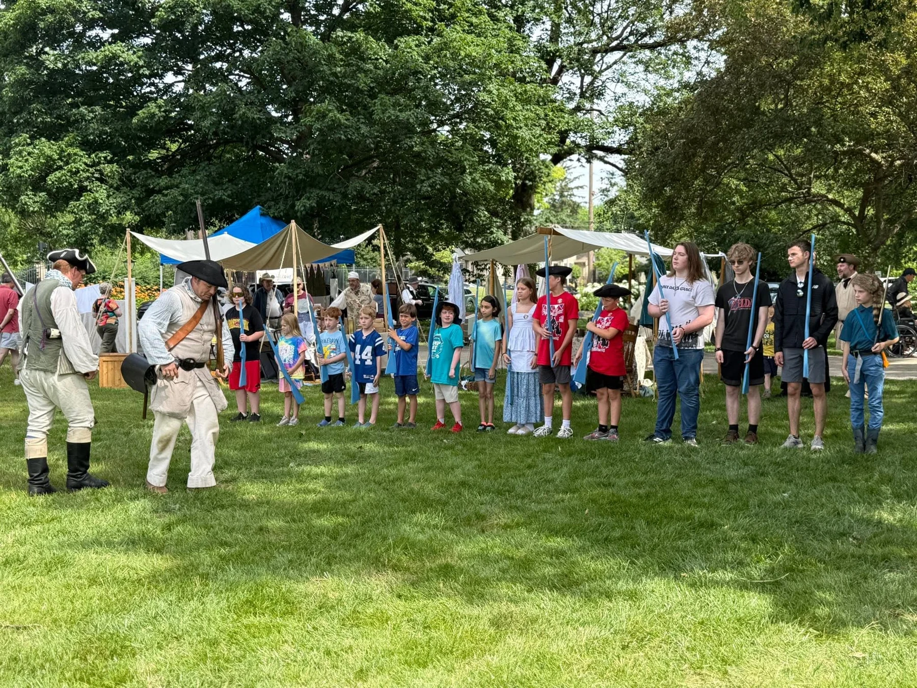 Visitors and interpreters gather on the lawn at the 2026 Colonial Fair.
